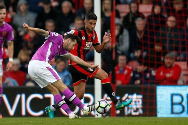 Hull City's Ryan Mason scores.