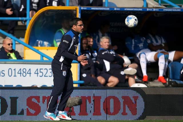ON ME HEAD SON: Huddersfield Town manager David Wagner attempts to control the ball. Picture: Danny Lawson/PA