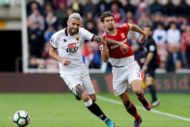 Watford's Valon Behrami (left) battles for the ball with Middlesbrough's George Friend (right) Picture: Owen Humphreys/PA