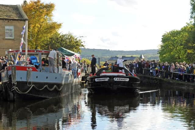 The Kennet and a flotilla of other boats pass through the 3 rise and 5 Rise Locks in Bingley.