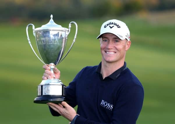 Sweden's Alex Noren celebrates with the trophy after his victory at the British Masters. Picture: Steven Paston/PA