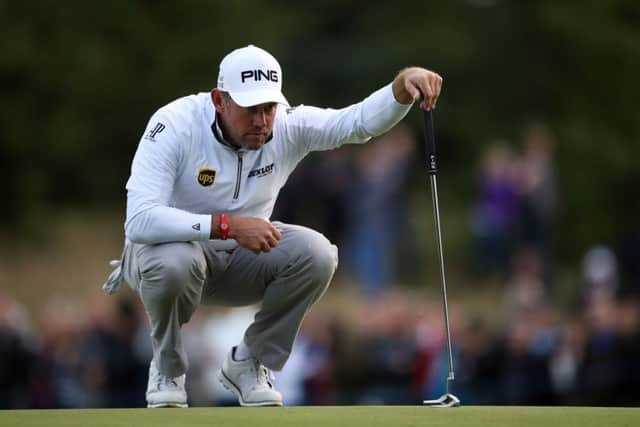 England's Lee Westwood lines up a putt on the 18th hole at The Grove during the British Masters. Picture: Steven Paston/PA .