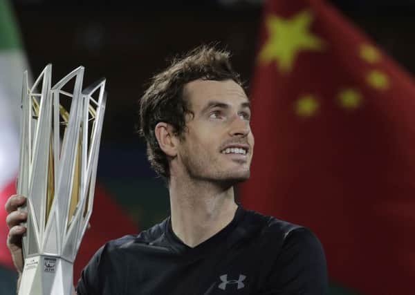 Andy Murray of Britain holds up his winner trophy after defeating Roberto Bautista Agut of Spain in the men's singles final of the Shanghai Masters. Picture: AP/Andy Wong
