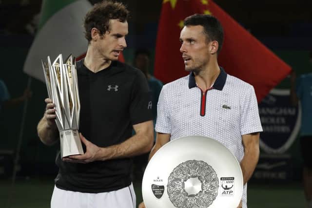 Andy Murray, left, chats with Roberto Bautista Agut of Spain after the award ceremony. Picture: AP/Andy Wong