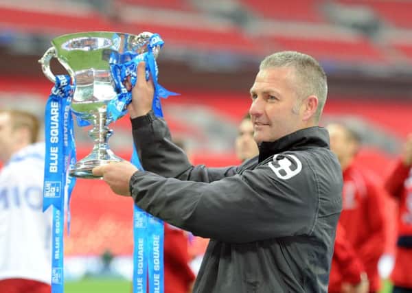 Gary Mills is back at the team he guided to promotion to the Football League in 2012.