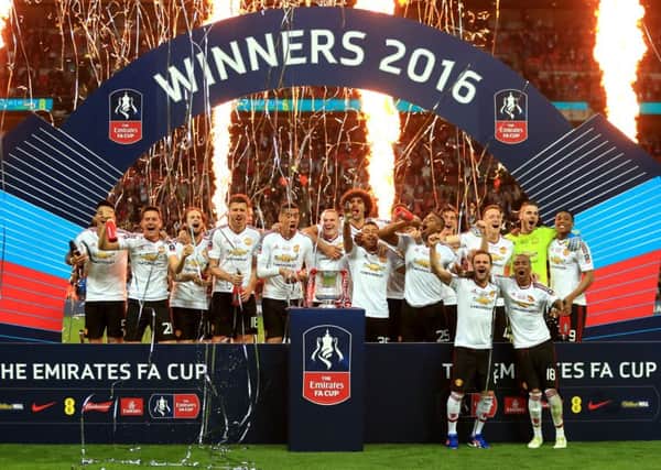 Manchester United players celebrate winning the FA Cup at Wembley against Crystal Palace in May this year. Picture: Mike Egerton/PA.