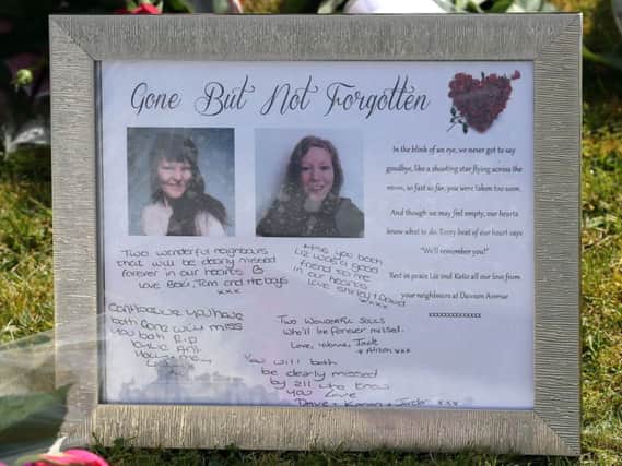 Tributes left outside a house in Spalding, where the bodies of 49-year-old Elizabeth Edwards and 13-year-old Katie were found