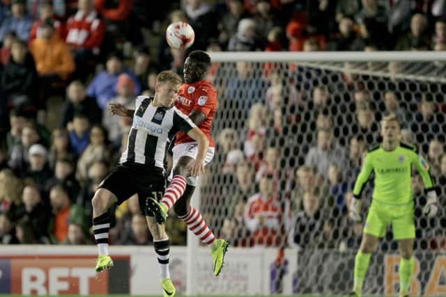 Newcastle United's Matt Ritchie (left) and Barnsley's Andy Yiadom battle for the ball.