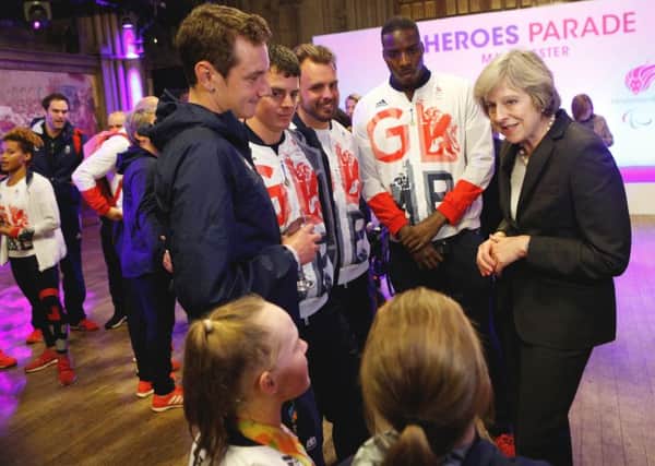 Prime Minister Theresa May meets Ellie Simmonds, Ellie Robinson, Alistair and Jonny Brownlee, Aled Davies and Lutalo Muhammad , during an event attended by members of Team GB and ParalympicsGB at Manchester Town Hall after thousands of sports fans braved heavy showers in Manchester to hail the heroic exploits of Great Britain's Olympic and Paralympic athletes.