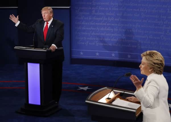 Democratic presidential nominee Hillary Clinton and Republican presidential nominee Donald Trump debate during the third presidential debate at UNLV in Las Vegas.