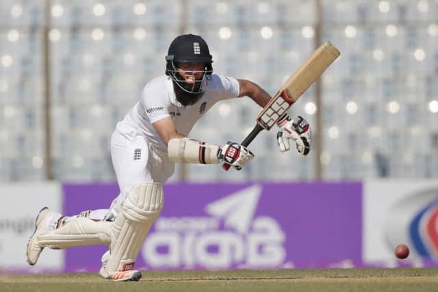 England's Moeen Ali plays a shot during the first day of their first cricket test match against Bangladesh (AP Photo/A.M. Ahad)