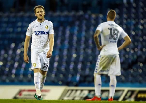 Leeds United's Eunan O'Kane (left) and Pontus Jansson show their frustation at the final whistle against Wigan on Tuesday night. Picture: Danny Lawson/PA.