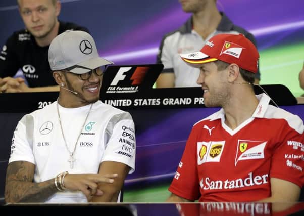 Lewis Hamilton, left, talks with Ferrari's Sebastian Vettel during a press conference ahead of the US Grand Prix in Austin, Texas. Picture: AP/Eric Gay