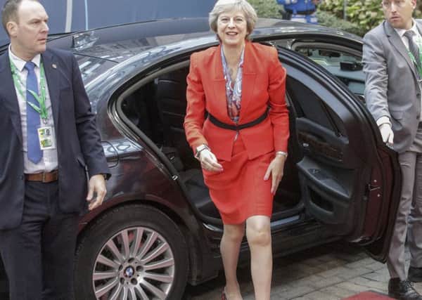 Theresa May arrives for the second day of the EU summit.