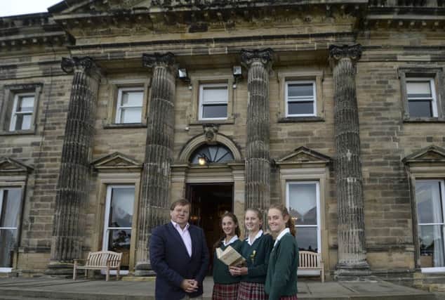 Author Robert Beaumont with  Queen Mary's pupils.  Left to right: Headgirl, Lillia Schiable, Frederica Crouch, and Imogen Patrick. Photo: Mike Cowling