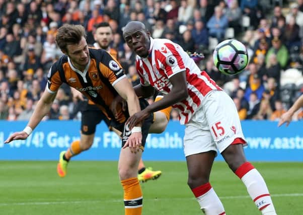 Hull City's Will Keane and Stoke City's Bruno Martins Indi battle for the ball.