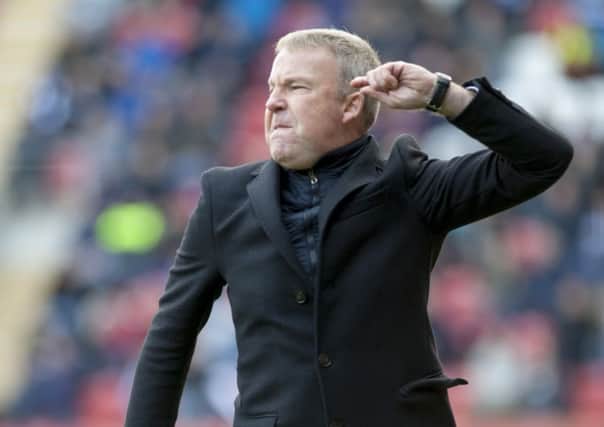 Rotherham's new manager Kenny Jackett barks instructions from the touchline