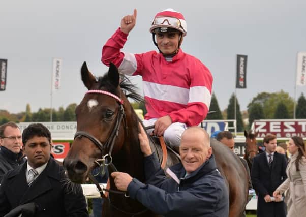 Andrea Atzeni celebrates after riding Rivet to victory in the Racing Post Trophy at Doncaster (Picture: Anna Gowthorpe/PA).