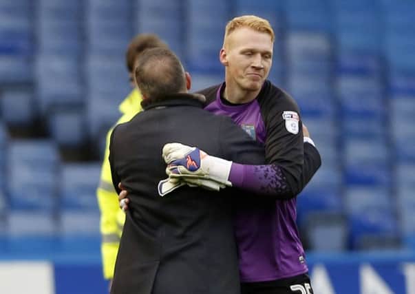 Owls young keeper Cameron Stewart keeps a clean sheet on his full Wednesday embraced by Carlos Carvalhal at the final whistle
