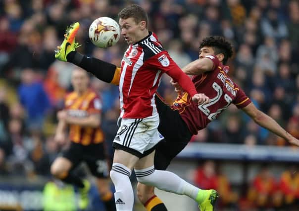 Nat Knight Percival of Bradford City and Caolan Lavery of Sheffield Utd battled for the ball. Picture date: Pic Simon Bellis/Sportimage