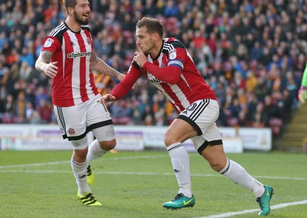 United's Billy Sharp celebrates the first goal.