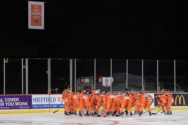 BANNER-RAISING: Sheffield Steelers' players prepare for Saturday night's match against Fife with the freshly-hung Elite League champions banner for 2015-16 hanging behind them. Picture: Dean Woolley.