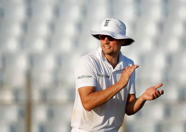 England's captain Alastair Cook applauds his team mates on the way to victory against Bangladesh (Picture: AM Ahad/AP).