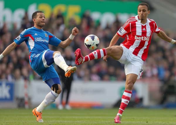 Peter Odemwingie (right) in action for Stoke City in the Premier League (Photo: PA)