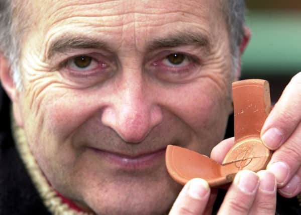 History man: Sir Tony Robinson with a Roman Samian wine cup found at a dig in Castleford. (YPN).