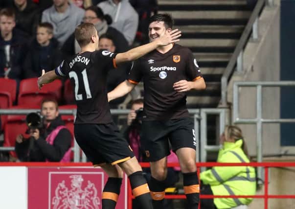 Hull City's Harry Maguire (right) celebrates scoring his sides first goal of the game with team mate Michael Dawson (left) during the EFL Cup, round of 16 match at Ashton Gate, Bristol. (Picture: PA)