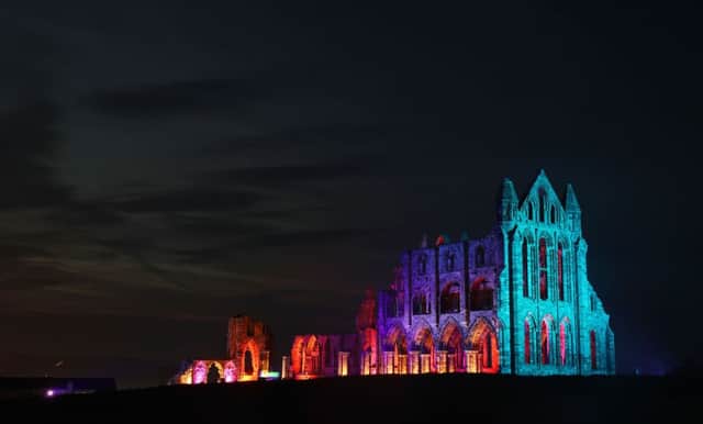 Whitby Abbey is lit up in lights to celebrate Halloween.