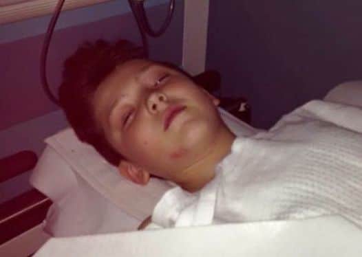 Dylan in hospital after he was dragged under the cara