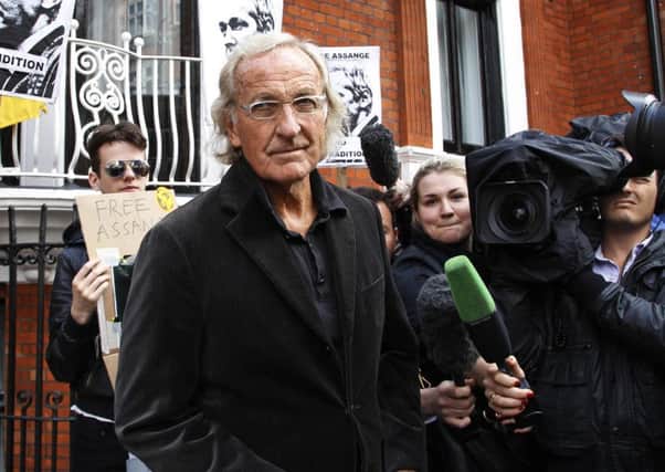 John Pilger, seen here ahead of a meeting with Julian Assange in 2012, is in Sheffield on Thursday. (AP).