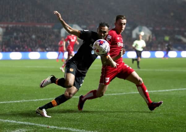 Hull City's Ahmed Elmohamady (left) and Bristol City's Joe Bryan (right) battle for the ball during the EFL Cup, round of 16 match at Ashton Gate, Bristol. (Picture: PA)