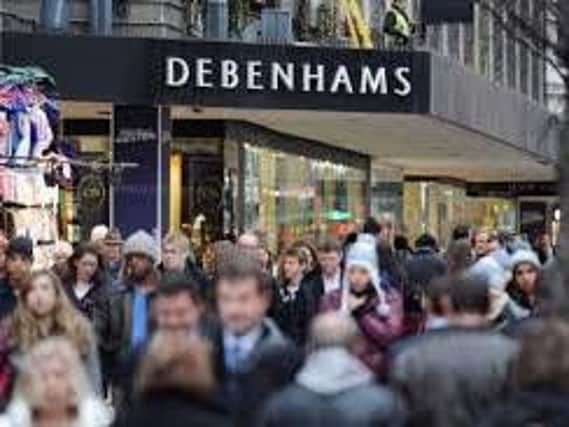 Debenhams has warned that demand for clothes was weak amid "uncertain trading conditions"