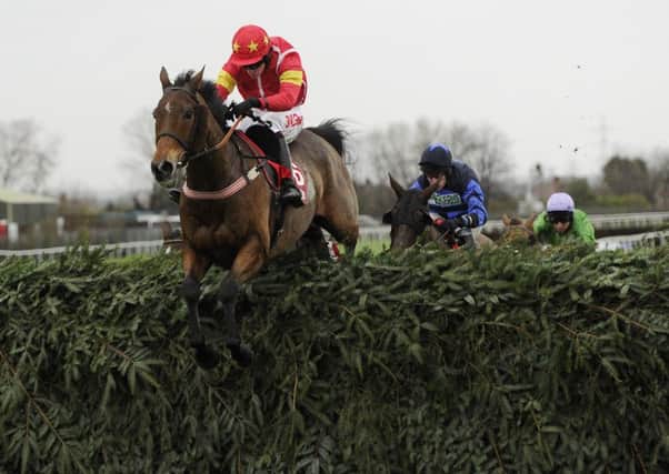 Highland Lodge and Henry Brooke jump the final fence as they win the Betfred Becher Chase at Aintree last December (Picture: John Giles/PA Wire).