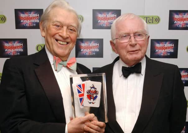 File photo dated 10/12/2003 of comedy writers Jimmy Perry (left) and David Croft with their lifetime achievement award during for the annual British Comedy Awards.