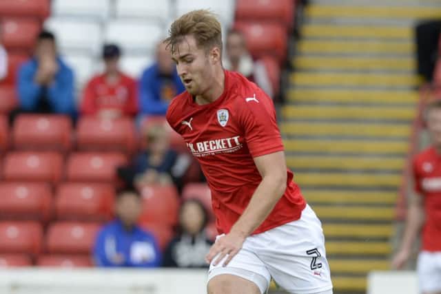 James Bree is overcoming his growing pains and aiming to cement a place in the Oakwell side and follow the likes of Alfie Mawson, inset, into the top flight.