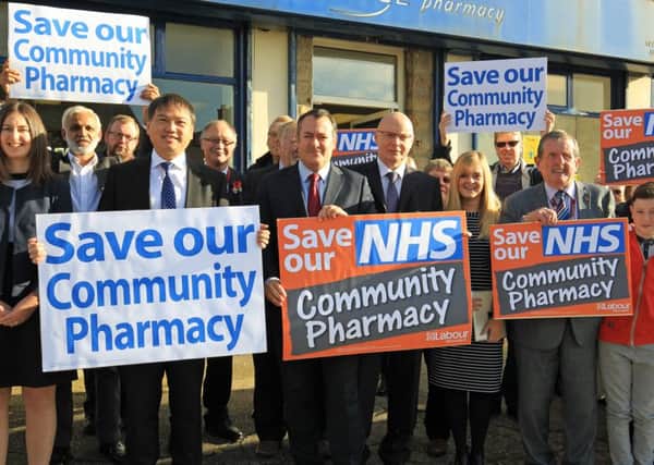 Barnsley East MP Michael Dugher and local residents held a protest against the Government's plan to impose cuts to community pharmacists outside Vantage Pharmacy in Worsbrough.