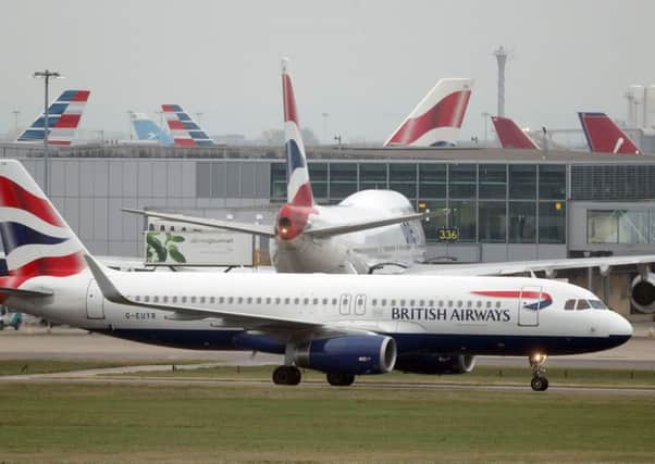Planes on the runway at Heathrow Airport