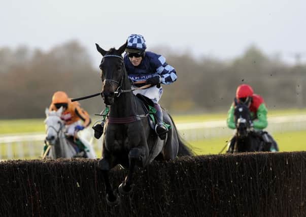 Menorah, ridden by Richard Johnson, jump the last fence as they go on and win the bet365 Charlie Hall Chase at Wetherby two years ago. Johnson, now 39, will look to recapture that form today, but faces a huge challenge from Cue Card. (Picture: John Giles/PA)
