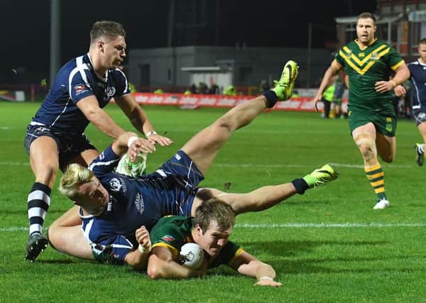Australia's Jake Trbojevic scores the final try of the game.