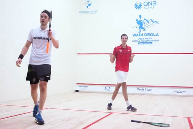 Ali Farag, right, celebrates victory over Yorkshire's James Willstrop, left, in the second round of the world championships in Cairo, Egypt. Picture courtesy of PSA.