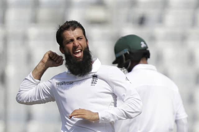 England's Moeen Ali celebrates the dismissal of Bangladesh's Imrul Kayes during the third day's play. Picture: AP/AM Ahad.