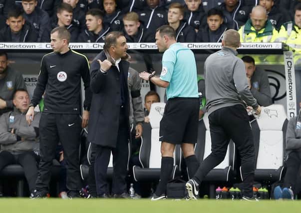 Owls Carlos Carvalhal argues with the referee at the IPro Stadium. Picture: Steve Ellis.