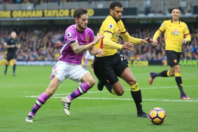 Hull City's Ryan Mason (left) battles for possession with Watford's Etienne Capoue at Vicarage Road. Picture: Nigel French/PA