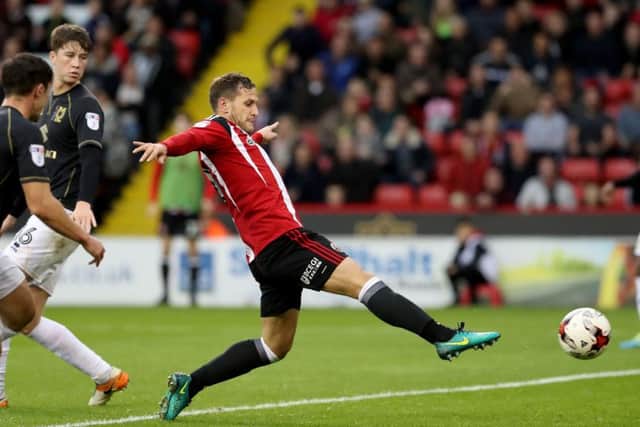 SHARP-SHOOTER: Billy Sharp scores Sheffield United's second goal of the game on Saturday. Picture: Jamie Tyerman/Sportimage