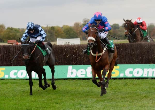 Cue Card ridden by Paddy Brennan (right) finishes third in the bet365 Charlie Hall Chase at Wetherby. Picture: Anna Gowthorpe/PA