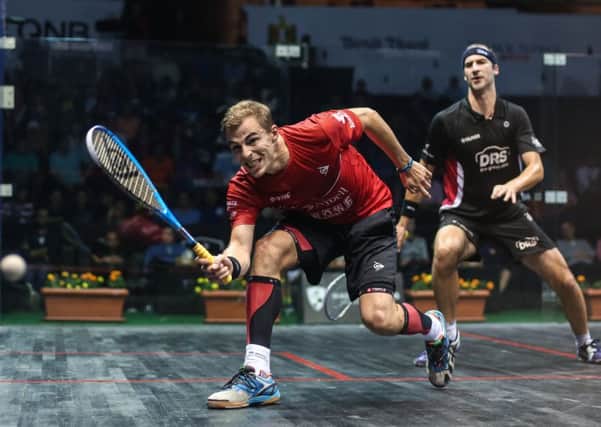 Nick Matthew puts in a drop shot against Germany's Simon Rosner.