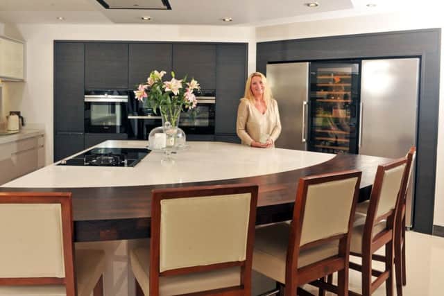 Kate in the kitchen with units by Harrogate-based Nest